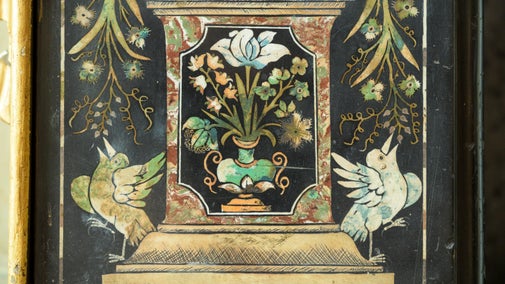 Detail of a chimneypiece with two birds and flowers in the Queen's Closet at Ham House and Garden, London